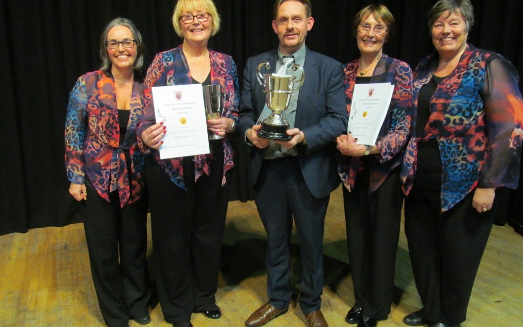 Trophy-winning Nelson Ladies’ Choir conductor John Garrett with (from left) Alison Ashworth, Janet Deighton, Margaret Bainbridge and Ann Myers-Brotherston